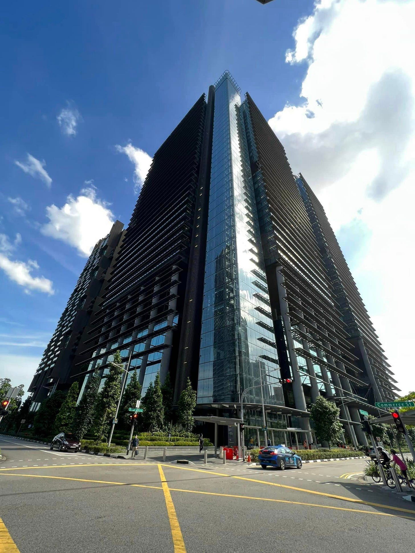 May be an image of 1 person, sky and skyscraper