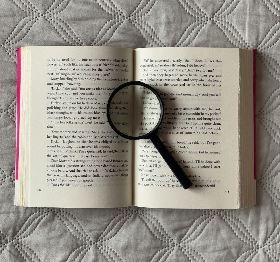 a book with a magnifying glass on top of it