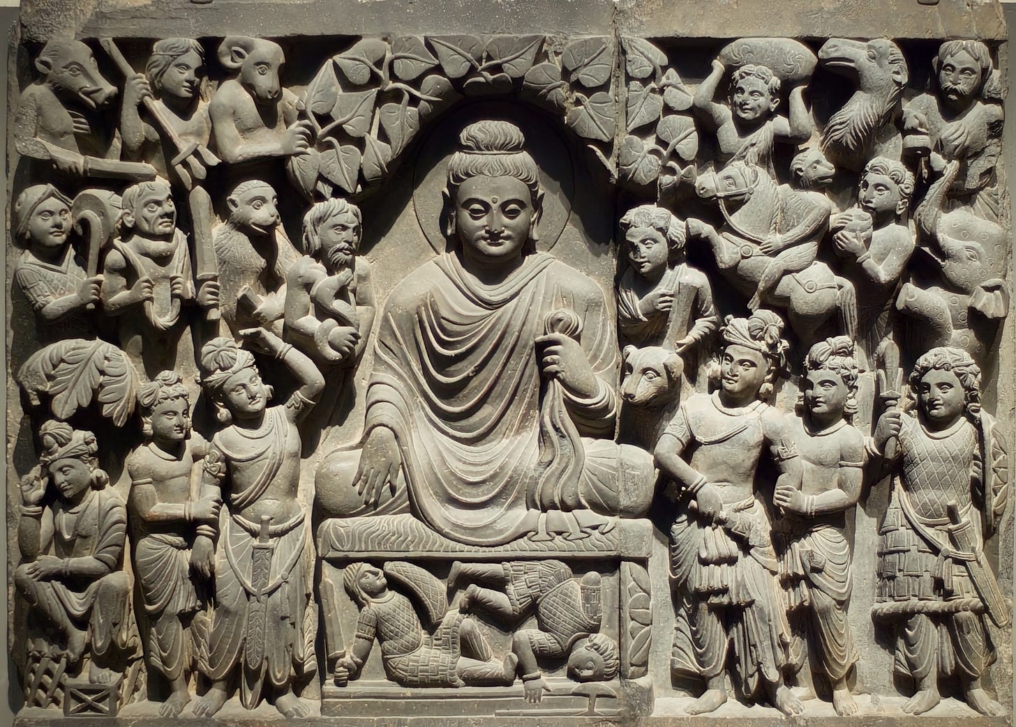 Photograph of what appears to be a mural made of stone or clay Photograph of what appears to be a mural made of stone or clay