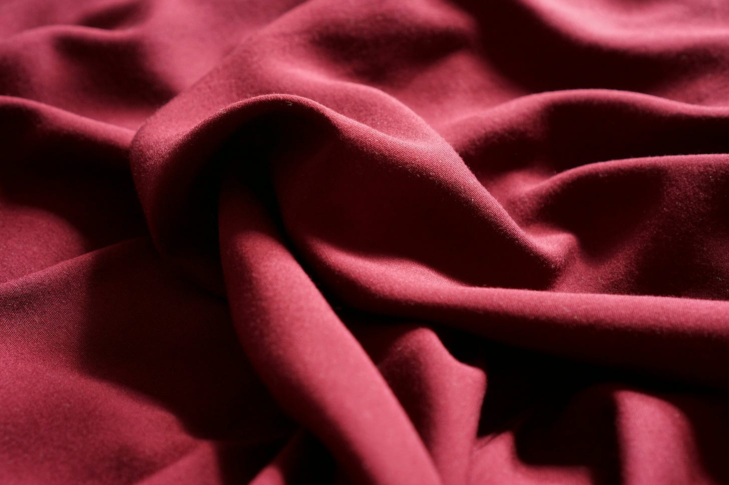 Folded fabric in red colour Folded fabric in red colour