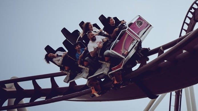 six person riding on roller coaster at daytime six person riding on roller coaster at daytime