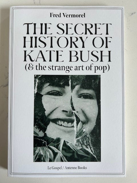 The secret history of kate bush has a white cover with black text. there is a collage picture that forms a woman's face.