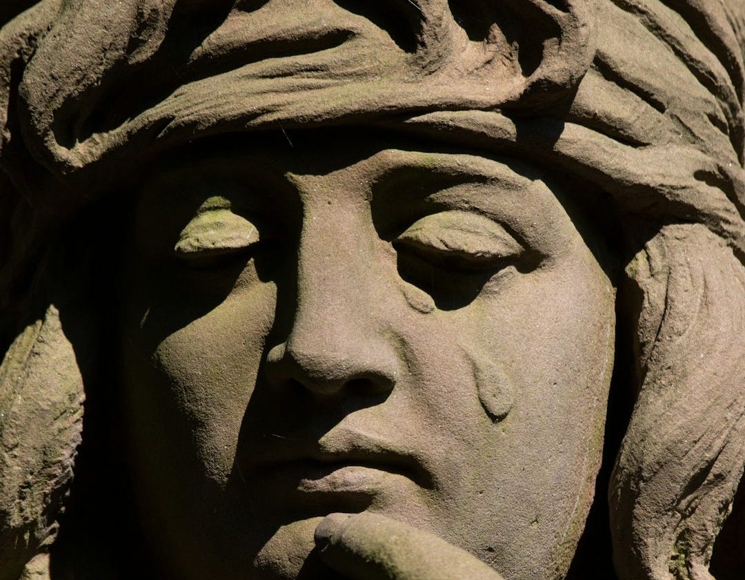 a close up of a statue of a woman