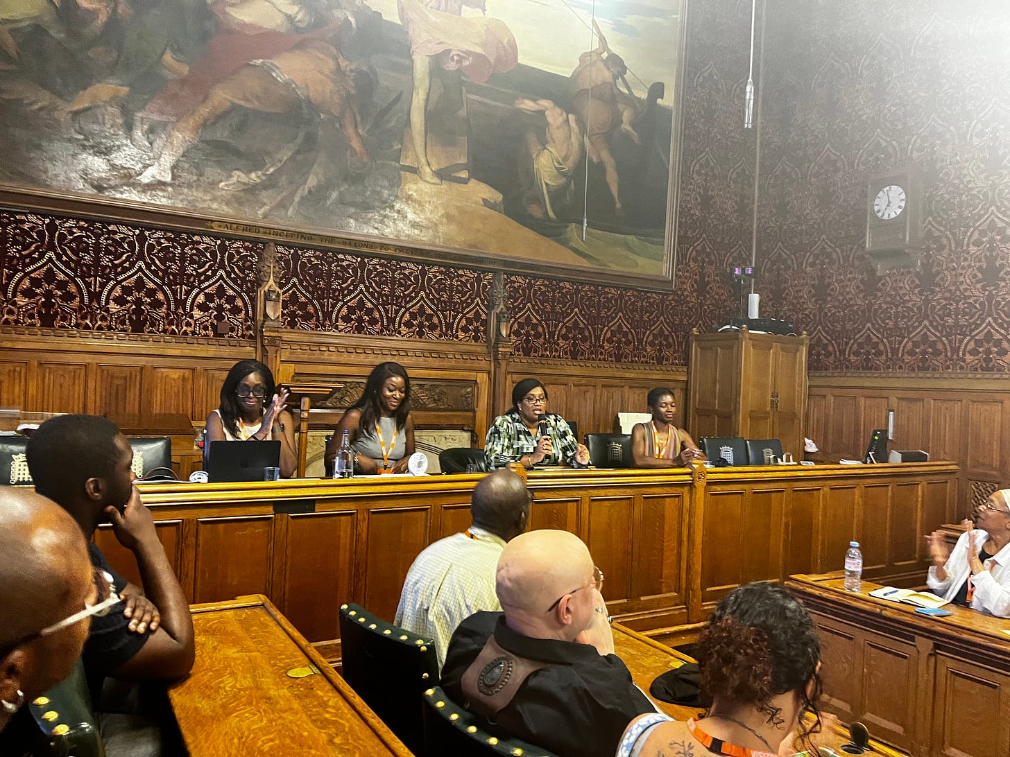 Four women in parliament presenting on the impact of air pollution on black women and children