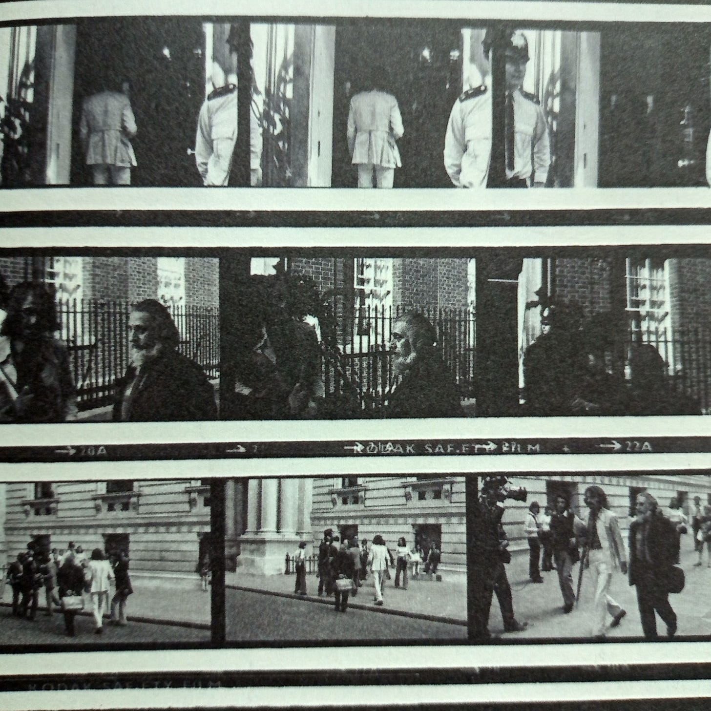 Contact print showing nine photos of Cobbing (in a dark suit) and MacBeth (in a light suit) walking along Whitehall and entering 10 Downing Street Contact print showing nine photos of Cobbing (in a dark suit) and MacBeth (in a light suit) walking along Whitehall and entering 10 Downing Street