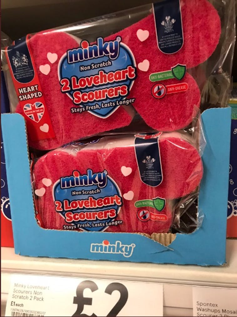 A photo which someone took in Tesco: Minky Loveheart Scourers Non Scratch 2 Pack £2. The item in question is, indeed, a scourer for washing plates and pans with, which is red and pink and in the shape of a heart