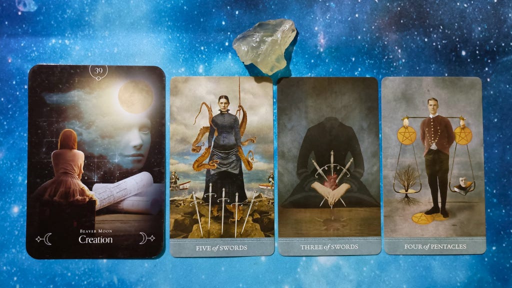 New Moon Magic: Your August 2025 Pick-a-Card Tarot Reading, pile 2 -Silk Agate stone (orange and brown) and 4 cards on a starry blue background
