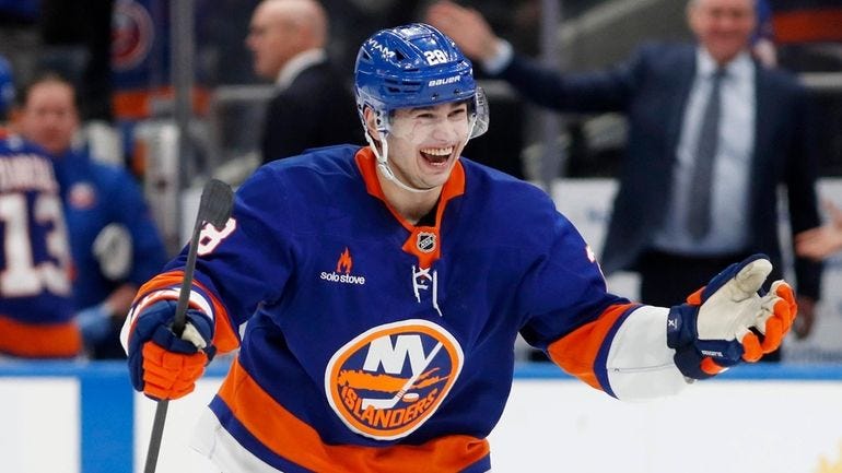 Alexander Romanov #28 of the Islanders reacts after an overtime victory... Alexander Romanov #28 of the Islanders reacts after an overtime victory...