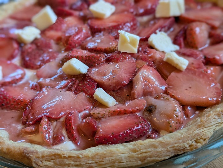 Macerated berries with excess liquid drained off, ready to be tossed in corn starch and filled into pie crust with bottom layer of creme fraiche. What the same pie looked like just before going into the oven. This one may have had a smidge too much liquid in the bottom.