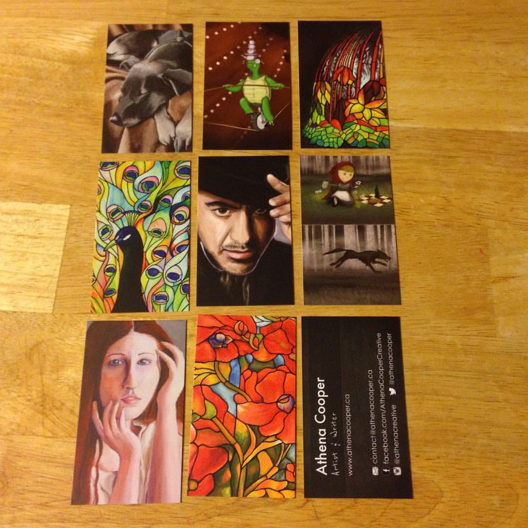 A selection of artwork printed on the backs of a set of MOO business cards.