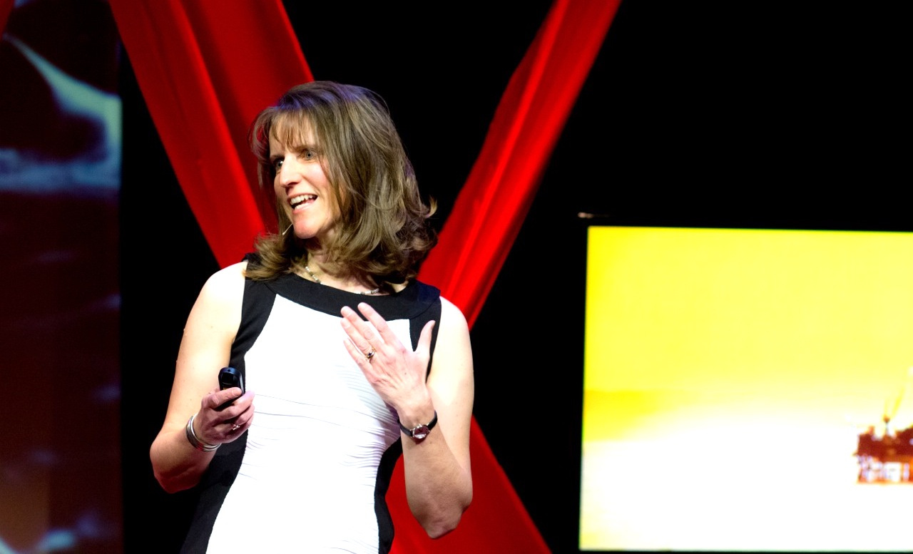 woman in white dress on a stage