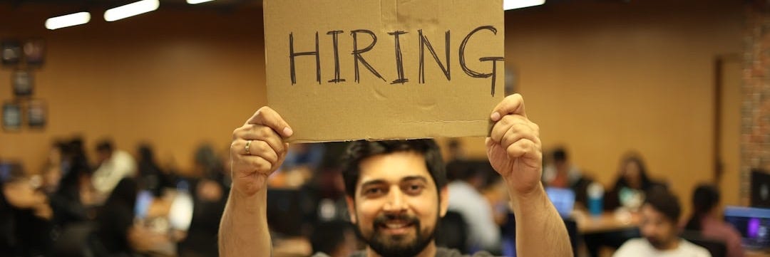 a man holding a sign