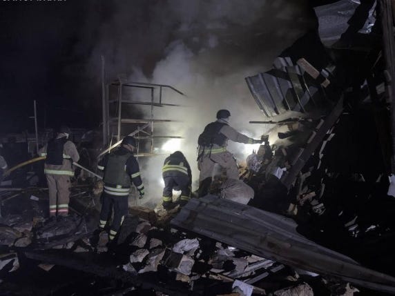 This handout photograph taken and released by the Ukrainian Emergency Service on December 24, 2025, shows Ukrainian rescuers reportedly working at the site of an alleged air strike in Zaporizhzhia, amid the Russian invasion of Ukraine. (Photo by H...