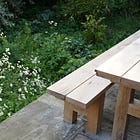 What materials should a patio or seating area be made from?