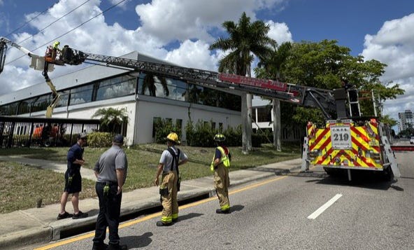High-Voltage Scare on Manatee Avenue: Workers Stranded After Lift Contacts Power Line