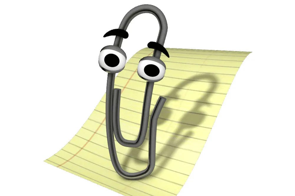 microsoft's clippy, a virtual assistant. he takes the form of a paperclip with eyes and, weirdly, eyebrows, against the backdrop of a way out of scale piece of lined paper.