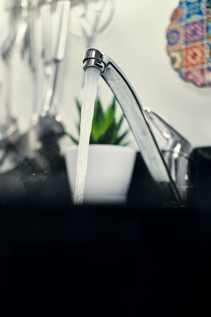 Running water from a household tap. Running water from a household tap.