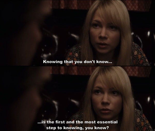 This may contain: a woman with long blonde hair talking to another person in the background, and text that reads