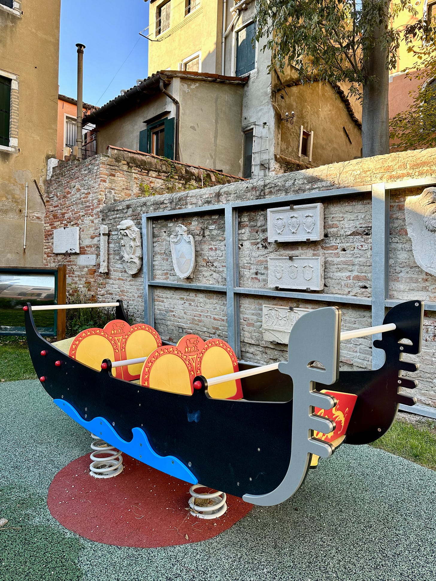 gondola spring rider behind Ca'Rezzonica in venice