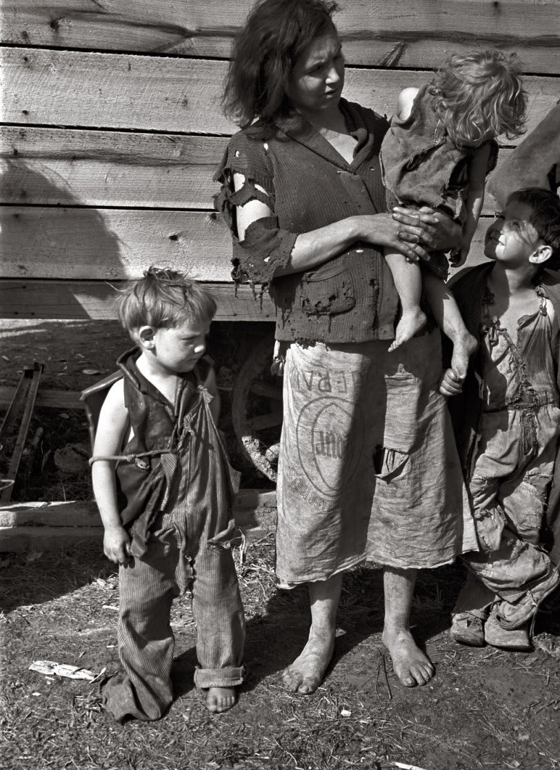 March 1936. "Mother and baby of family of nine living in field on U.S. Route 70 near the Tennessee River." 35mm nitrate negative by Carl Mydans for the Farm Security Administration. View full size.
