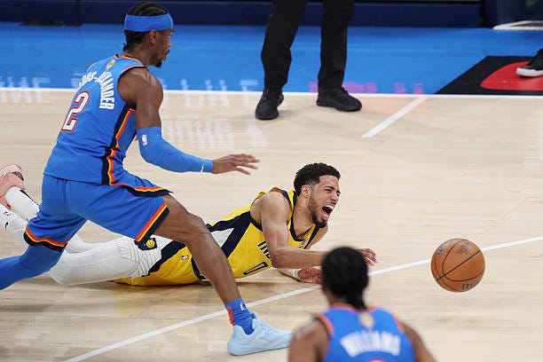 Tyrese Haliburton of the Indiana Pacers sustains an injury during the first quarter against the Oklahoma City Thunder in Game Seven of the 2025 NBA...
