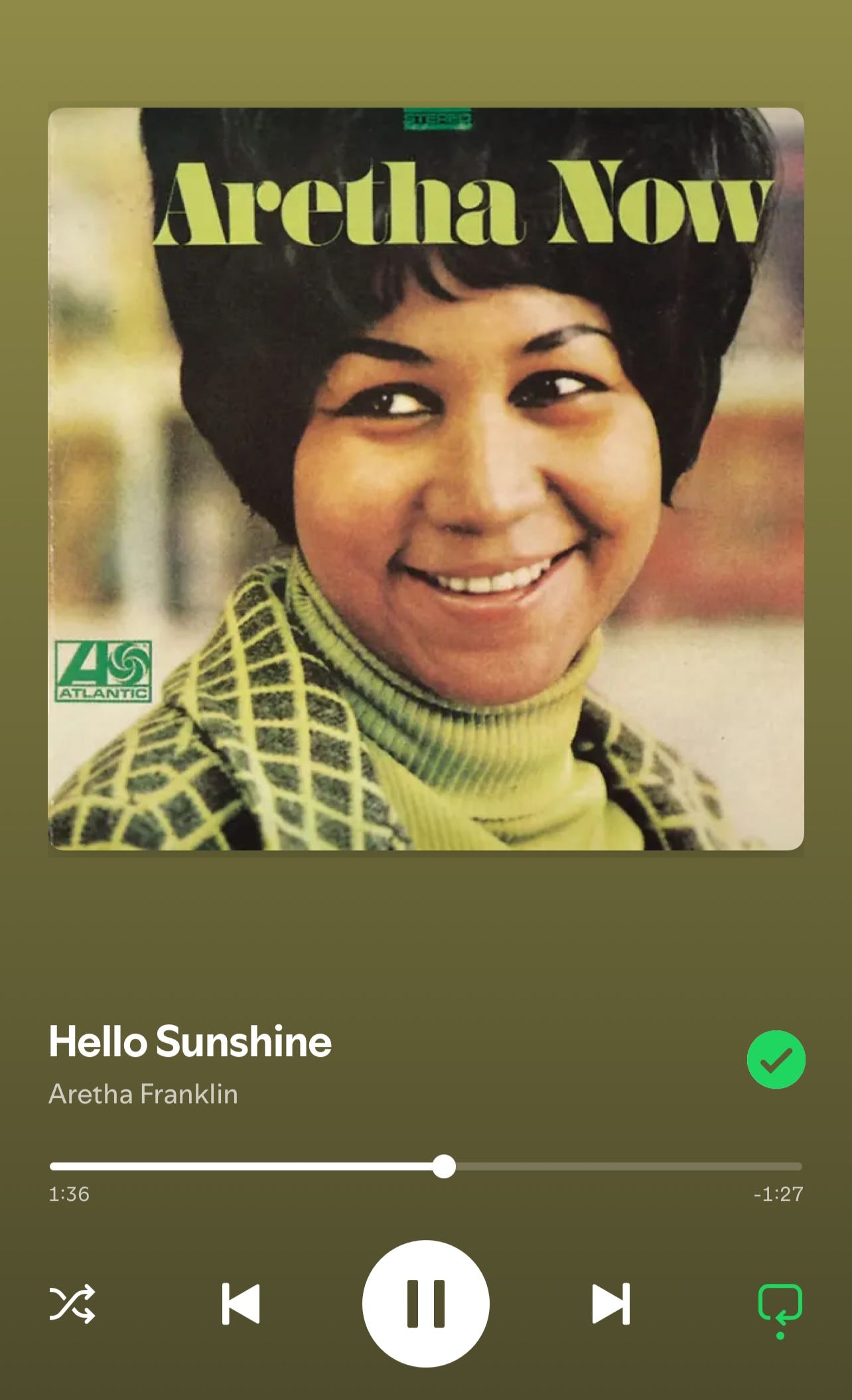 A screenshot of Spotify playing the song "Hello Sunshine" by Aretha Franklin