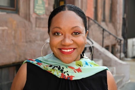 A person smiling for the camera

Description automatically generated with medium confidence