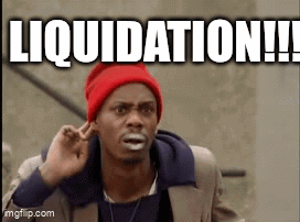 a man wearing a red hat and a suit is making a funny face with the words liquidation written above him .