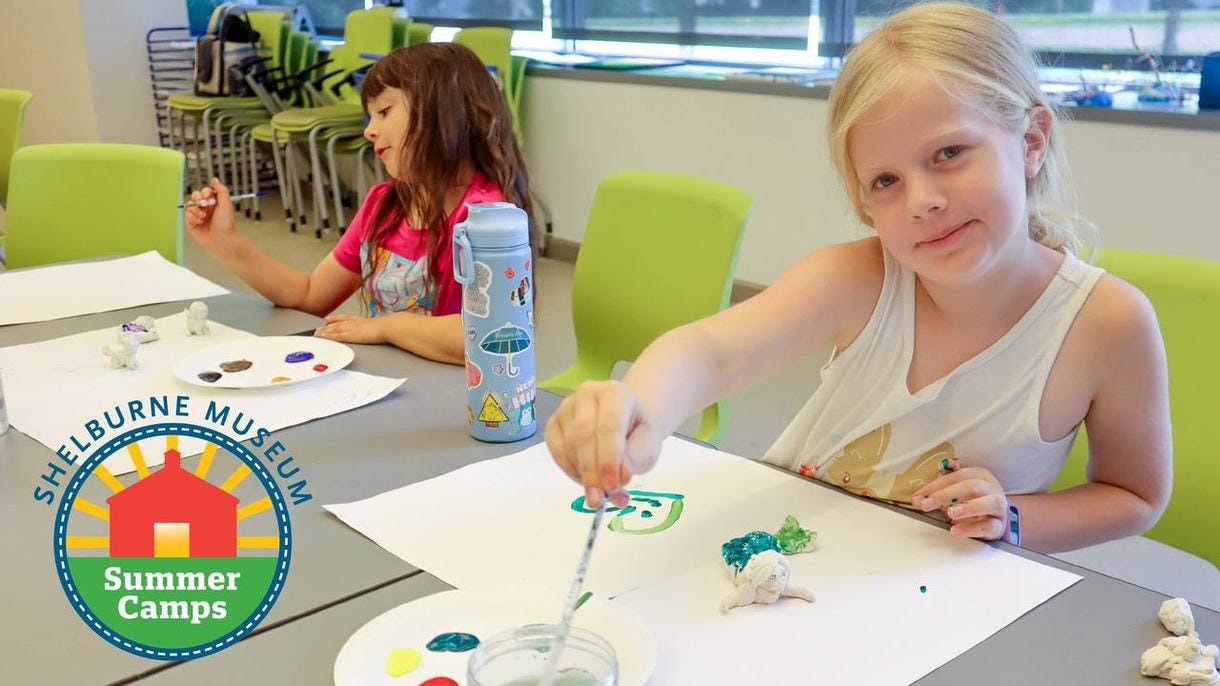 Two kids painting at a table