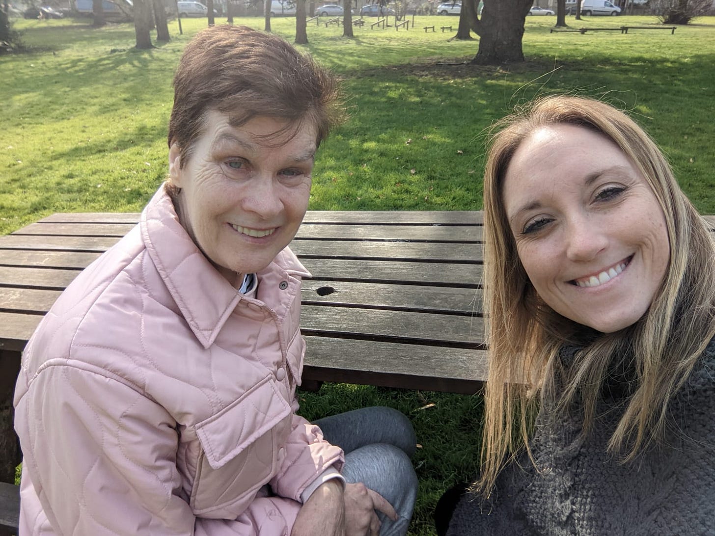 May be an image of 2 people, people smiling and grass