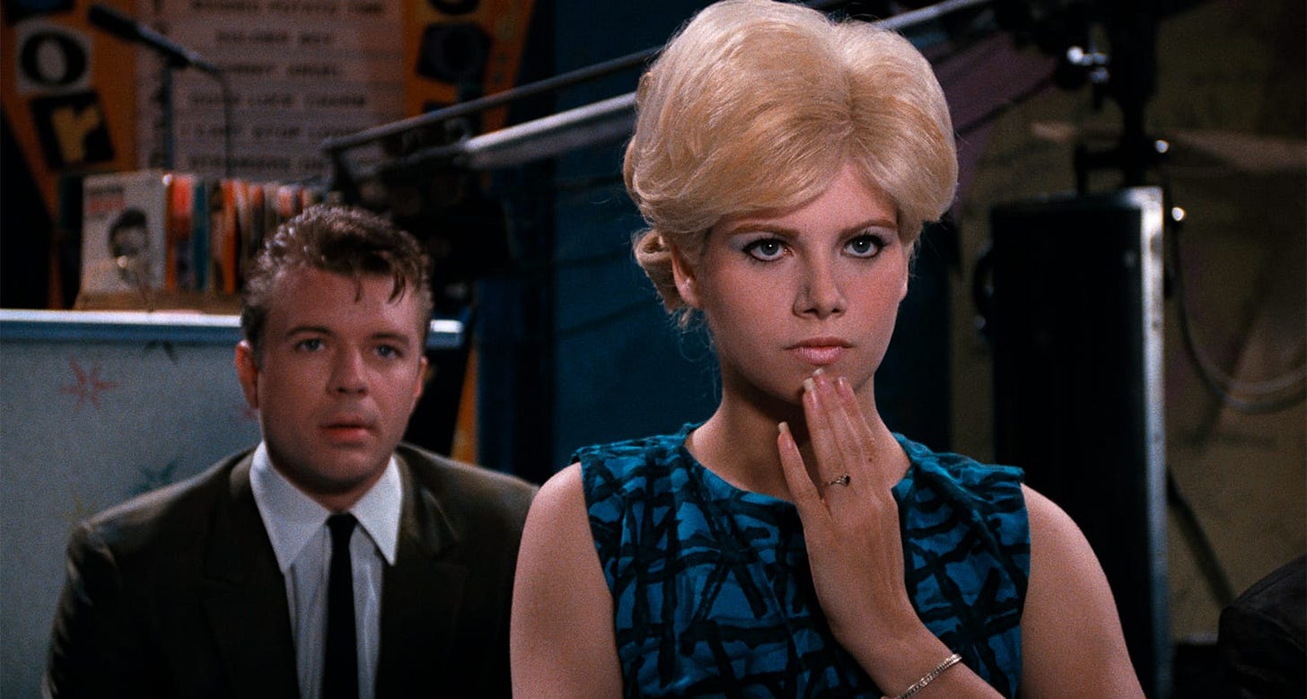 Hairspray | Still features Amber von Tussle (Colleen Fitzpatrick) with Corny Collins (Shawn Thompson) right behind her.