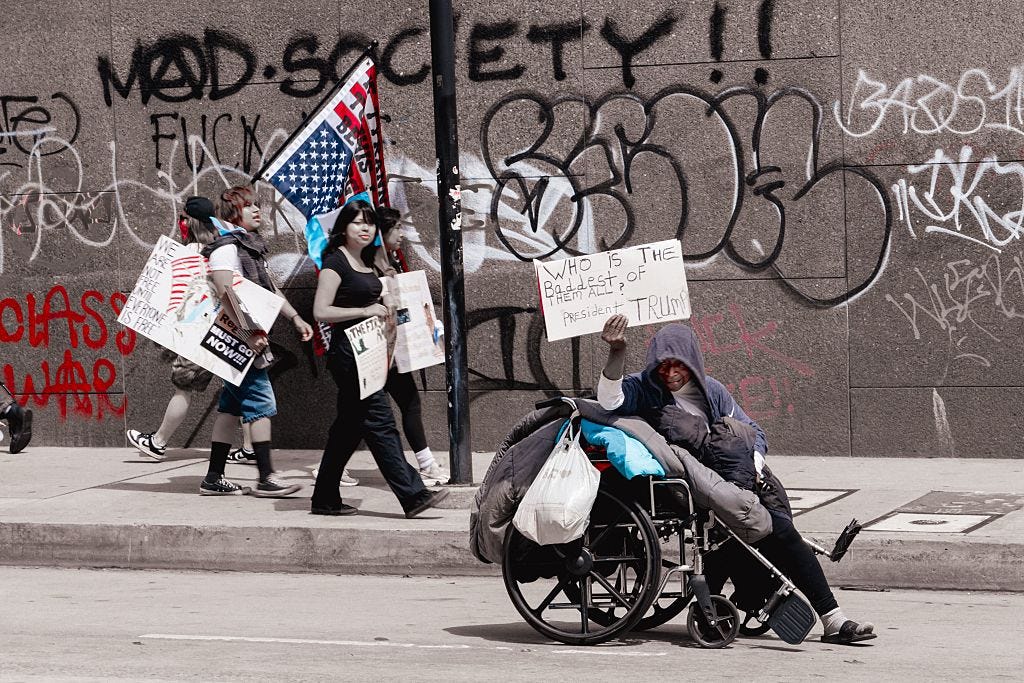 NO KINGS Immigration Protest shows all races protesting ICE raids of Trump Administration feature colorful signs in downtown Los Angeles, CA.