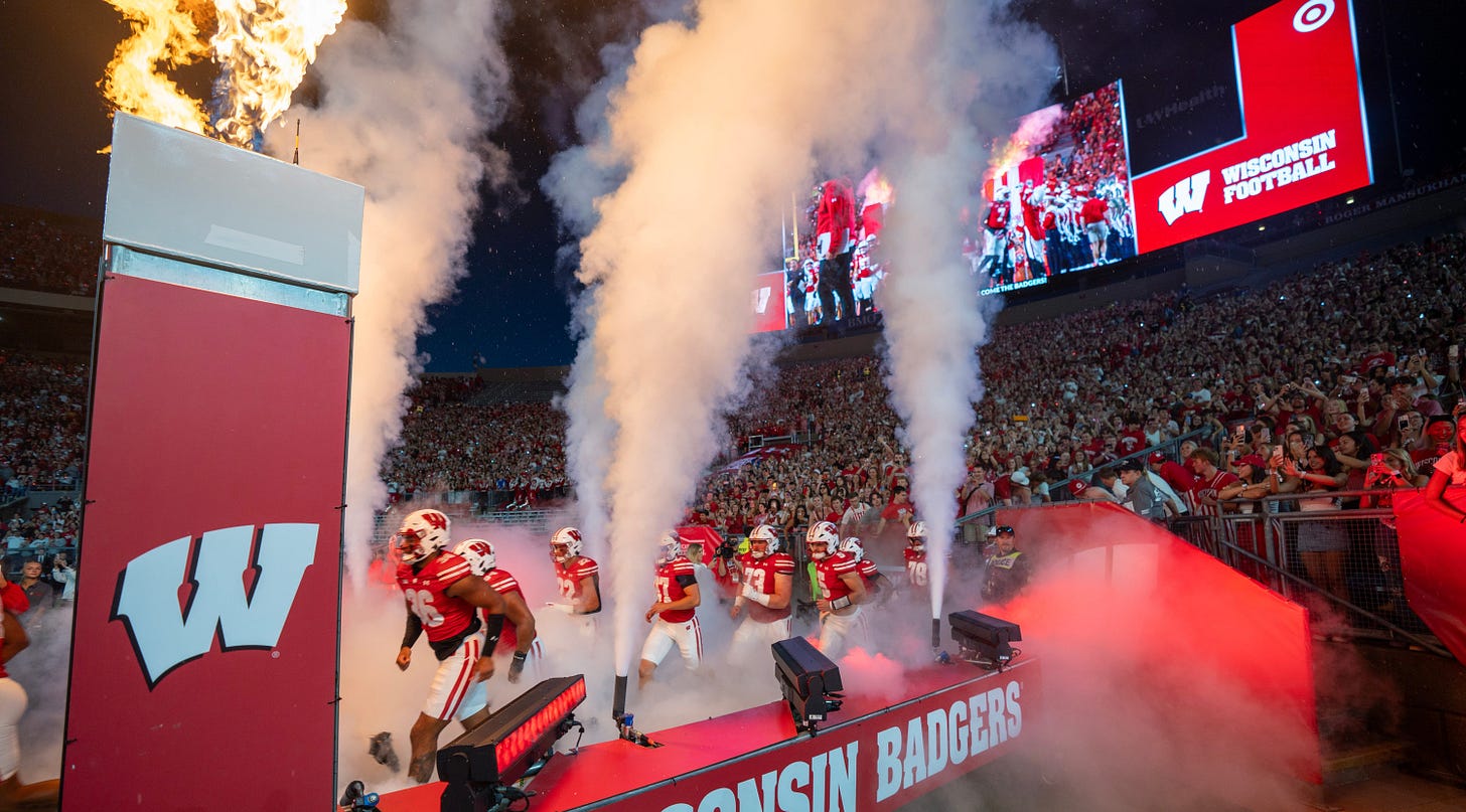 The Wisconsin Badgers run onto the field before their game at Camp Randall Stadium in Madison The Wisconsin Badgers run onto the field before their game at Camp Randall Stadium in Madison
