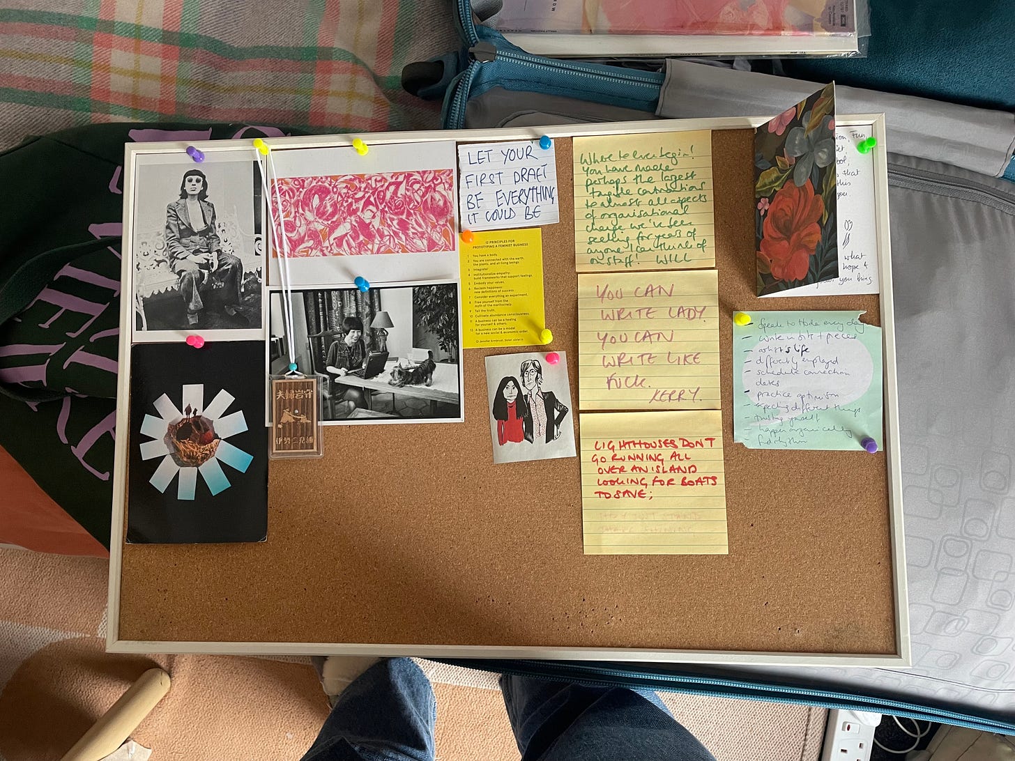 A pinboard covered in quotes and pictures