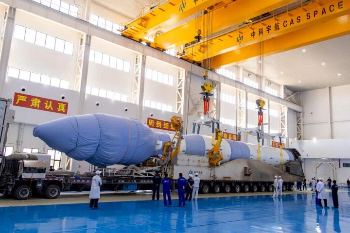 The Kinetica-1 Y10 vehicle being placed onto its transporter-erector (left) and being brought to its launch pad (right).