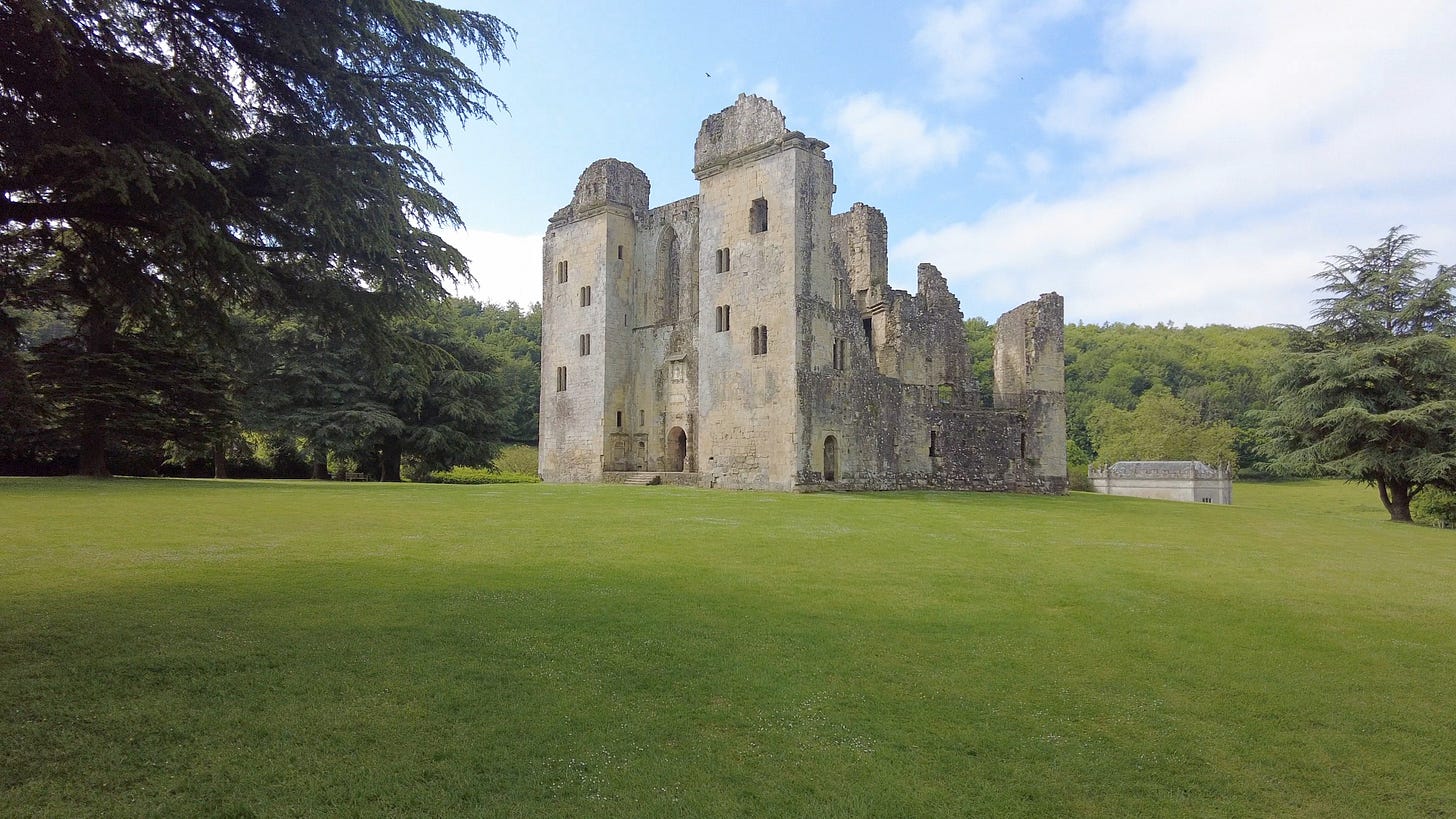 Wardour Castle in Wiltshire. The ruins are managed by English Heritage. The castle still has the front entrance intact as we can see in this photo and is surrounded by beautiful trees.