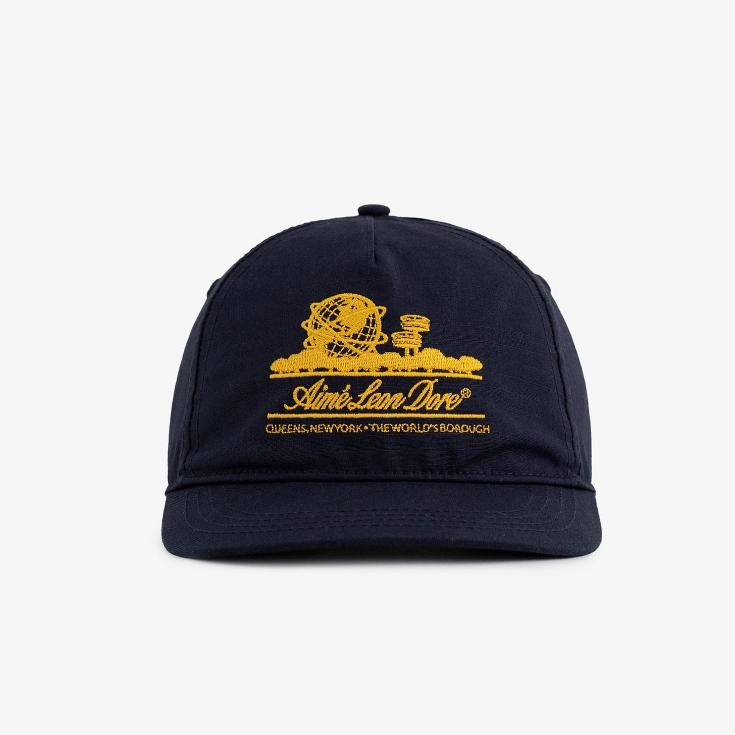 Unisphere Hat in navy with a yellow embroidered globe and Aimé Leon Dore text on the front. Unisphere Hat in navy with a yellow embroidered globe and Aimé Leon Dore text on the front.