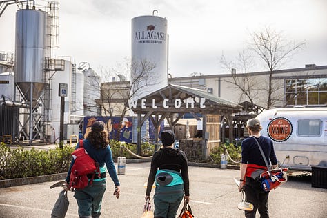 A scientist in a lab, a poet standing in a field, and three paddlers walking up to Allagash Brewing.