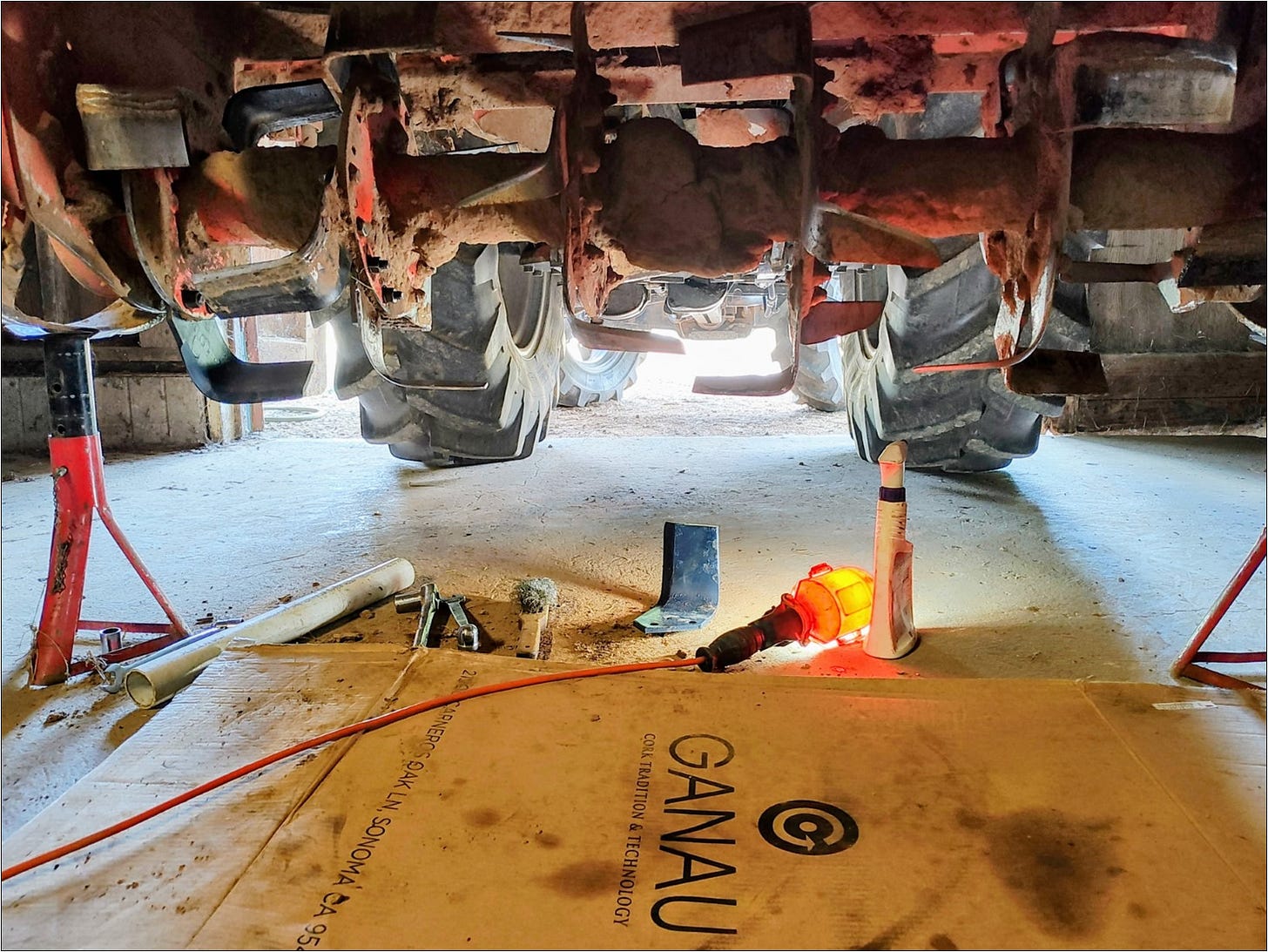Farm equipment maintenance replacing well worn rototiller tines.