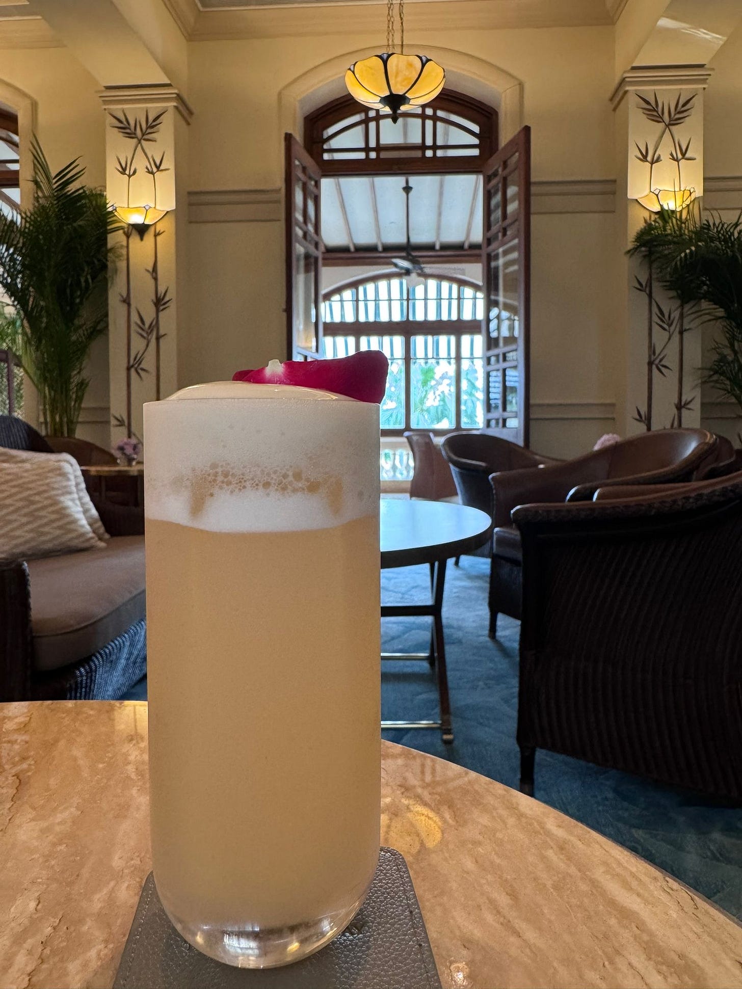 A glass of beer on a table

AI-generated content may be incorrect.