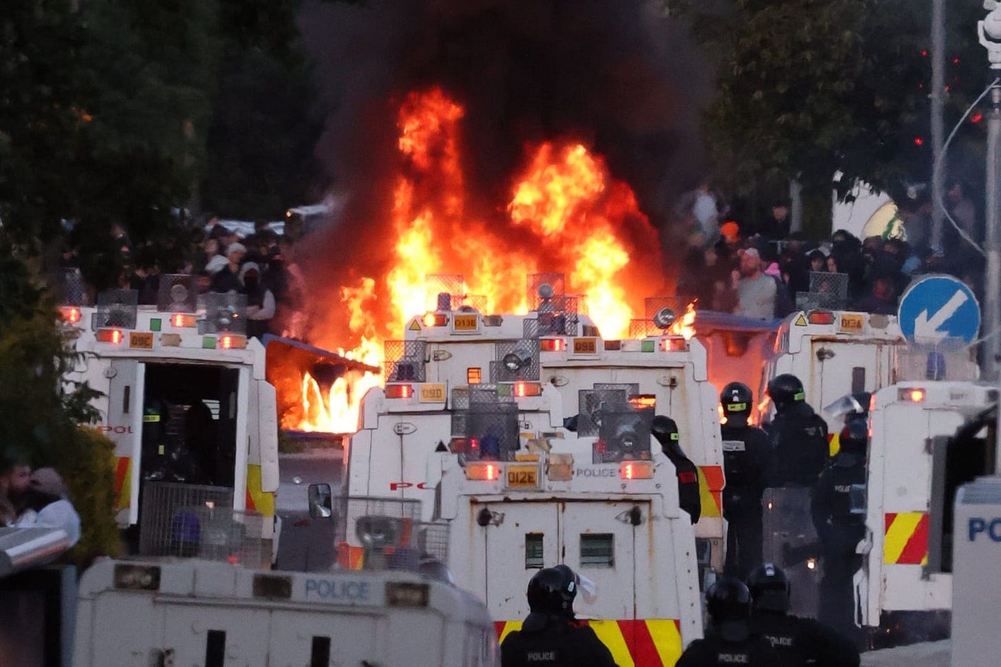 Protesters set fire to a barricade as police block Antrim Road, at the Sandyknowes roundabout in Newtownabbey (PA). Protesters set fire to a barricade as police block Antrim Road, at the Sandyknowes roundabout in Newtownabbey (PA).