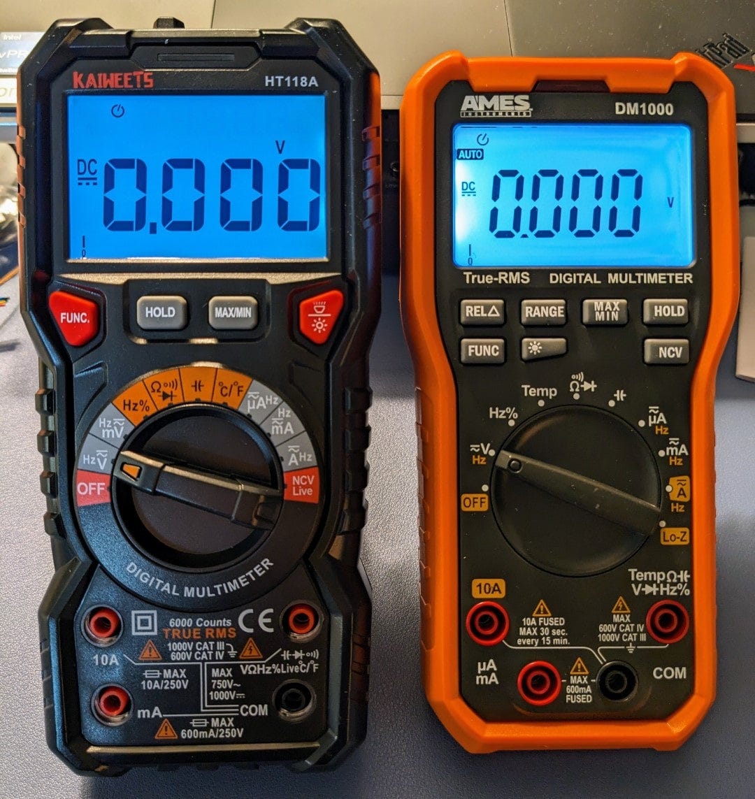 Displays backlit, multimeters propped up on integrated stands