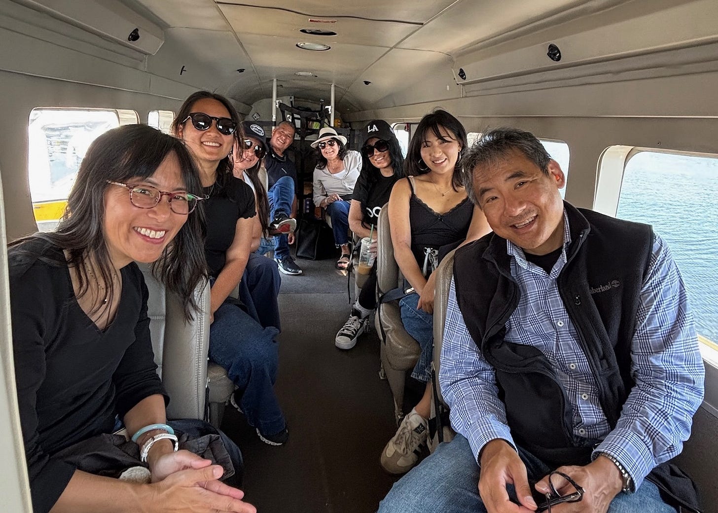 Stephen Pao, Marsha Pao, Christina Pao, and Annalisa Pao with the family of Marsha's cousin inside the cabin of a Kenmore Air seaplane Stephen Pao, Marsha Pao, Christina Pao, and Annalisa Pao with the family of Marsha's cousin inside the cabin of a Kenmore Air seaplane