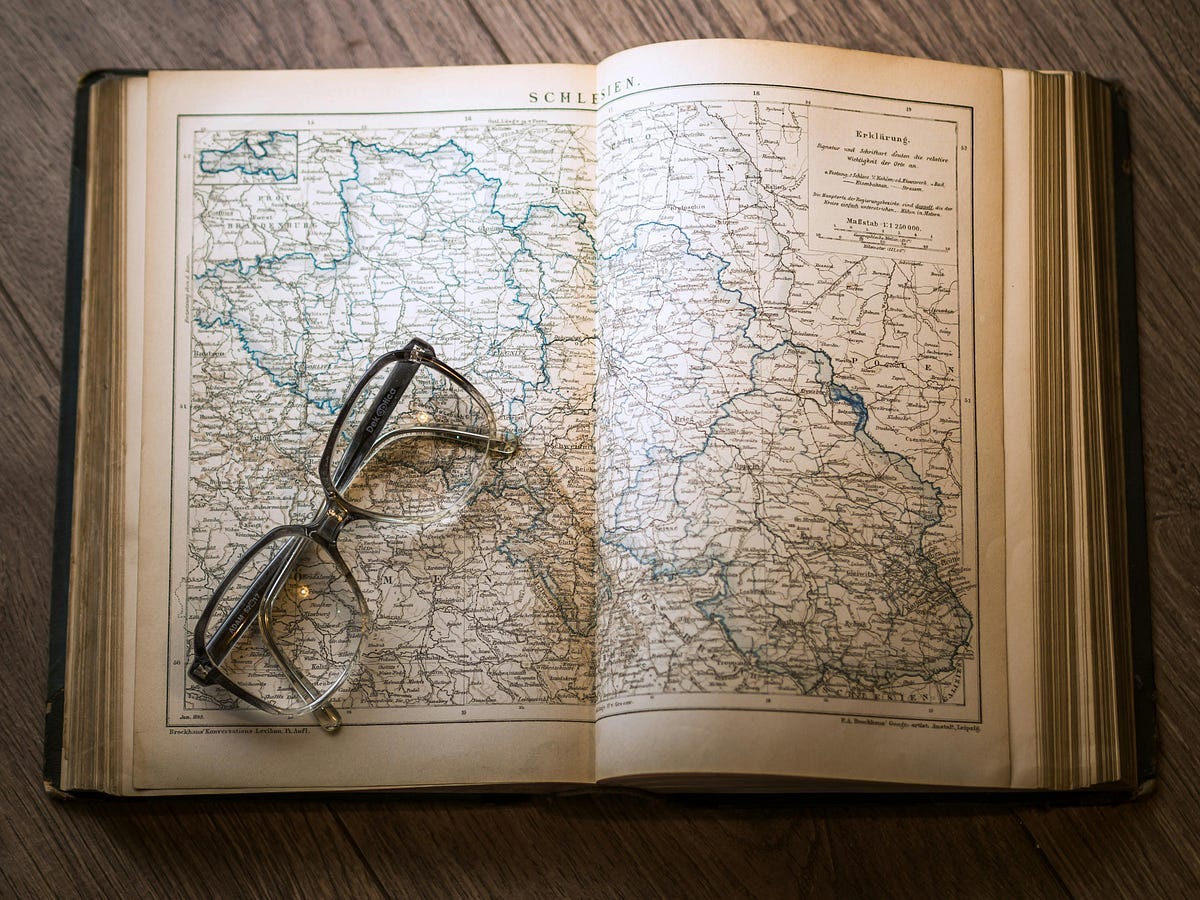 Glasses on old history book