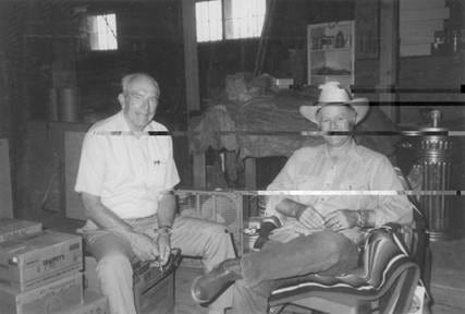 A couple of men sitting in chairs

AI-generated content may be incorrect.