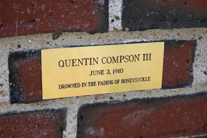 May be an image of text that says 'QUENTIN COMPSON III JUNE 2, 1910 DROWNED IN ΓHE FADING OF HONEYSUCKLE'