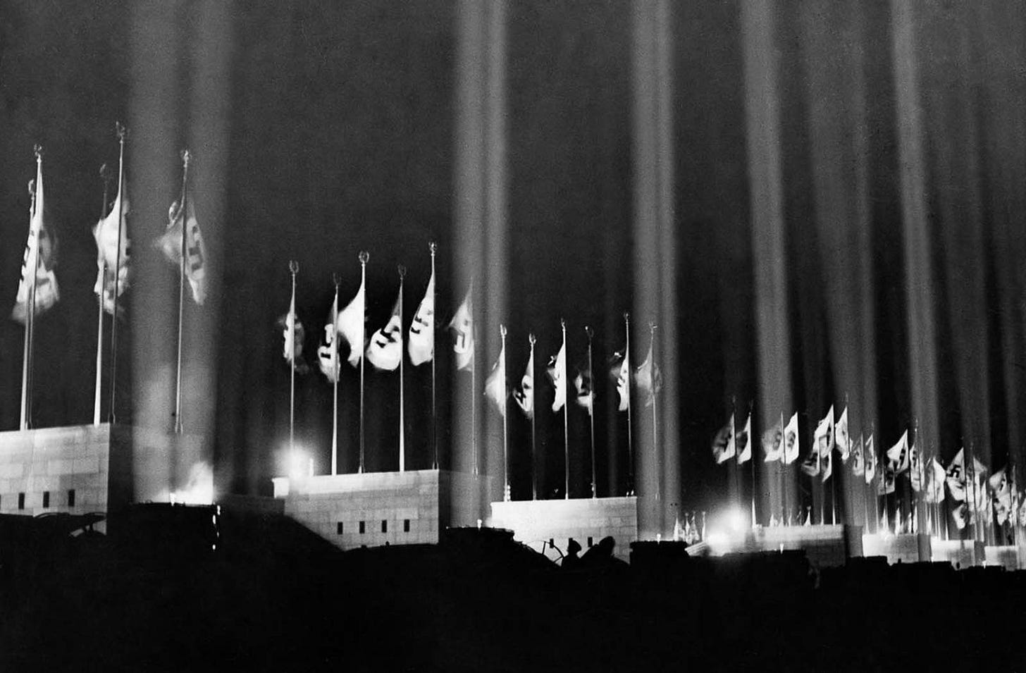 Iconic Nazi flags prominently surrounding the rally venue, 1936. Iconic Nazi flags prominently surrounding the rally venue, 1936.