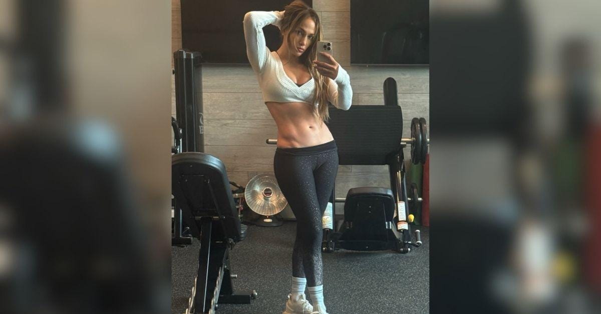 image of Jennifer Lopez showed off her toned abs in a gym selfie. image of Jennifer Lopez showed off her toned abs in a gym selfie.