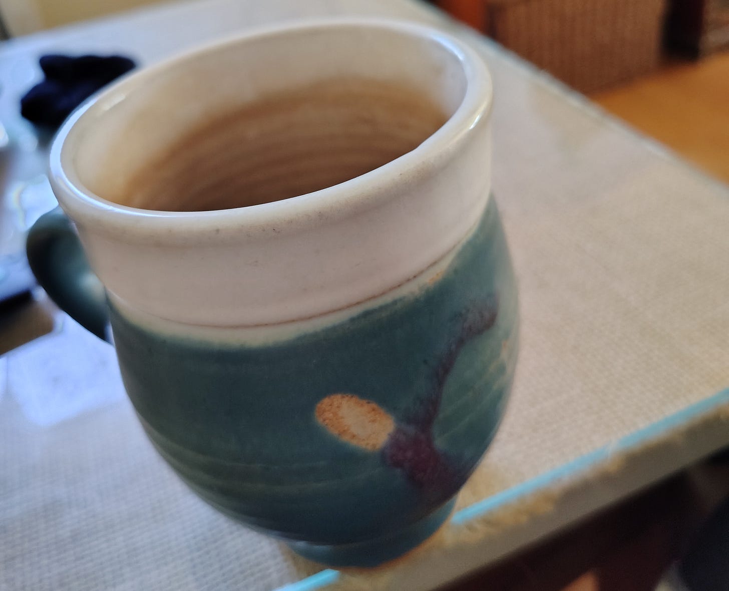coffee cup stained with tea from over use (productive office space)