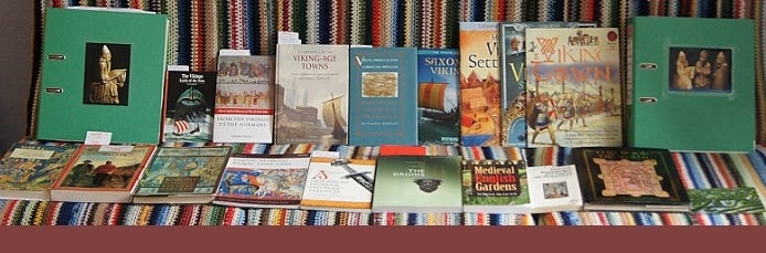 Stack of carefully selected books — blending primary sources, biographies, and archival documents used to build authentic historical characters.